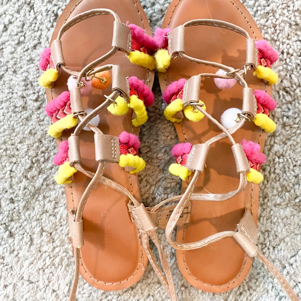 Pink and yellow pom-pom gladiator sandals